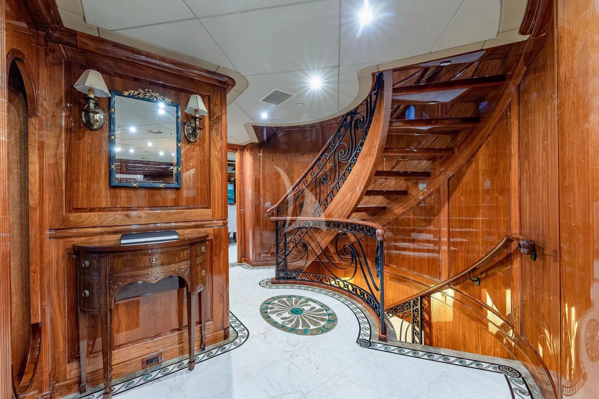 a room with a wood cabinet and a mirror aboard AMORE Yacht for Charter