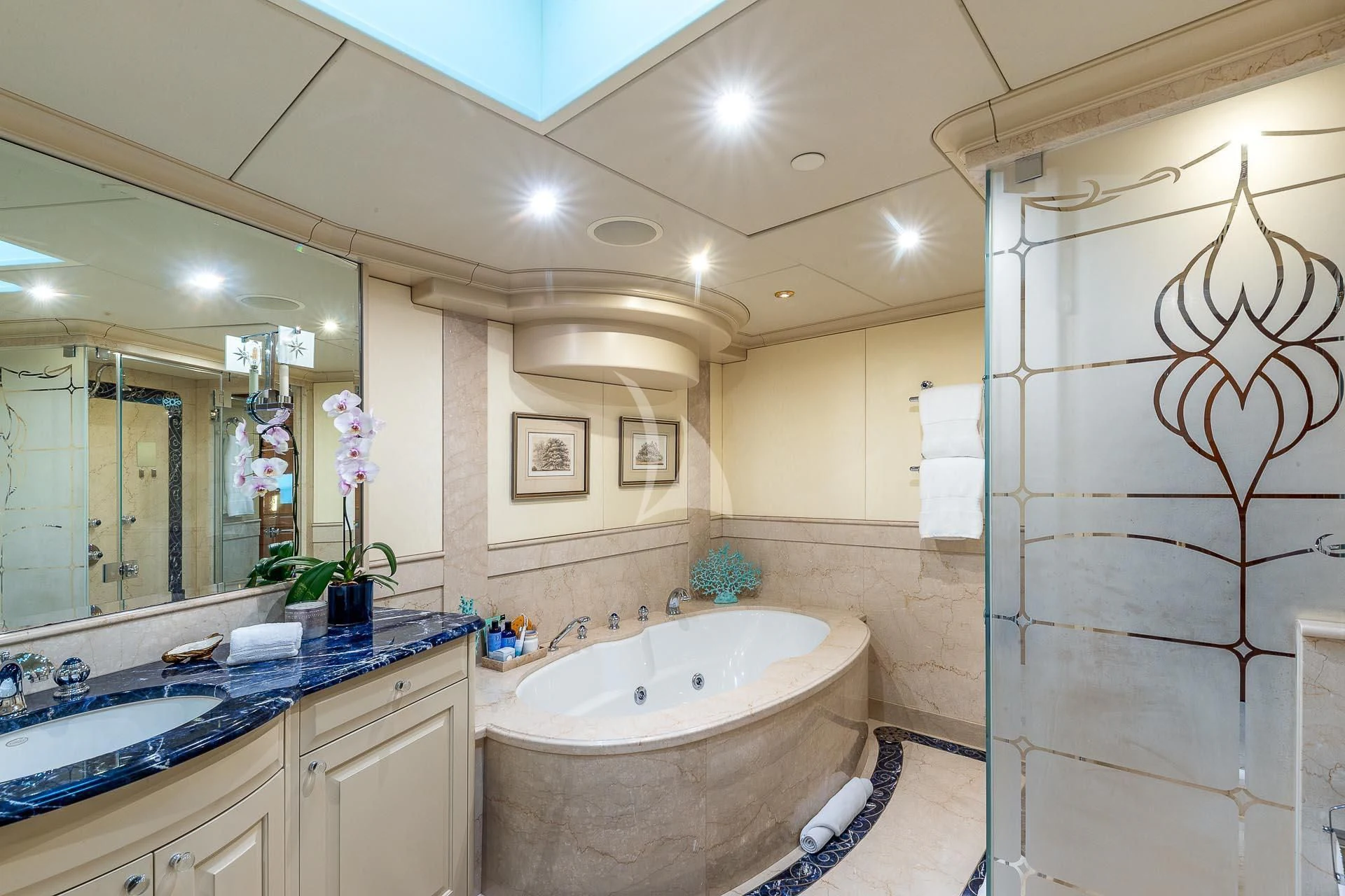 a bathroom with a large shower aboard AMORE Yacht for Charter