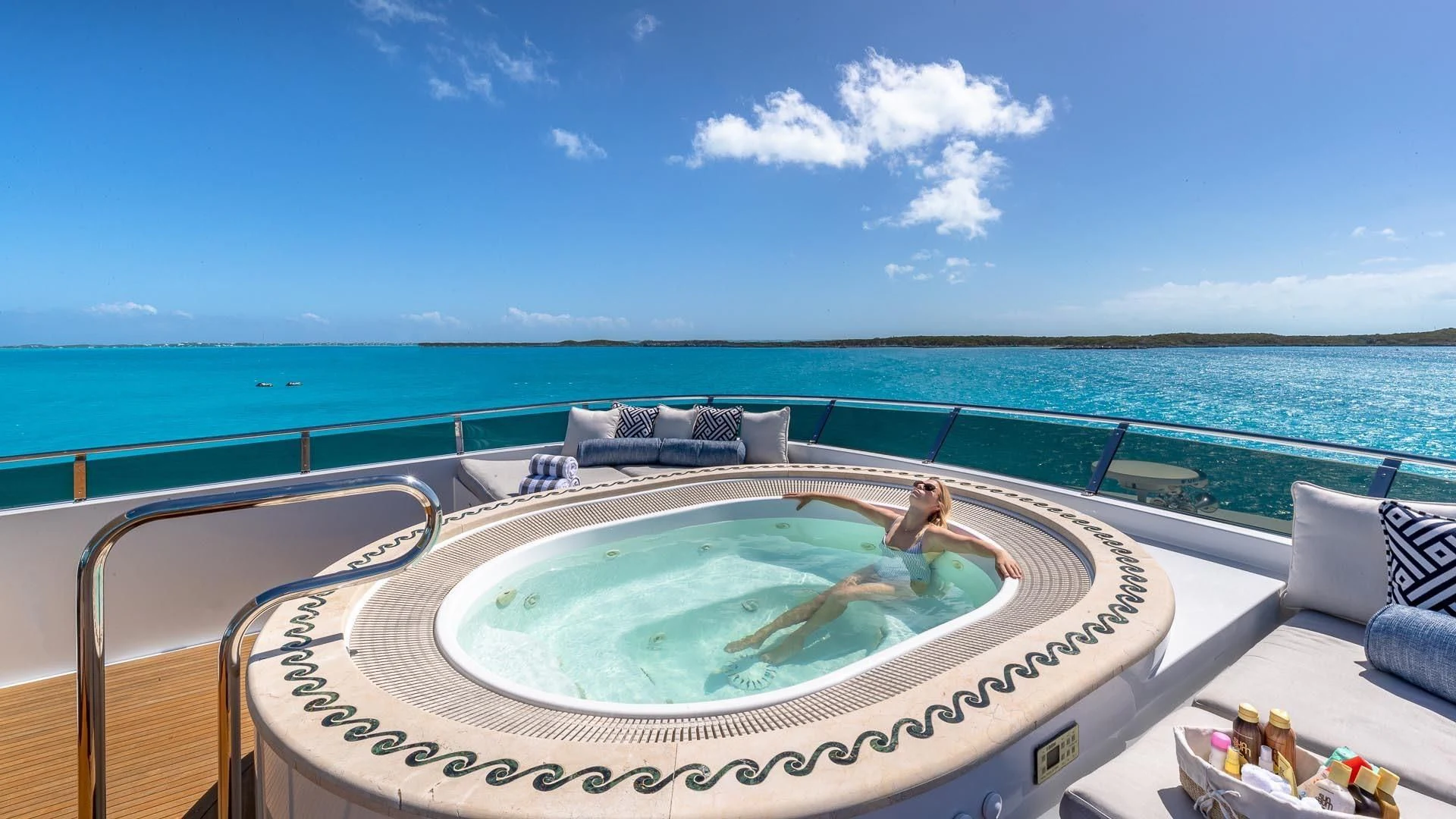 a pool on a deck overlooking the ocean aboard AMORE Yacht for Charter