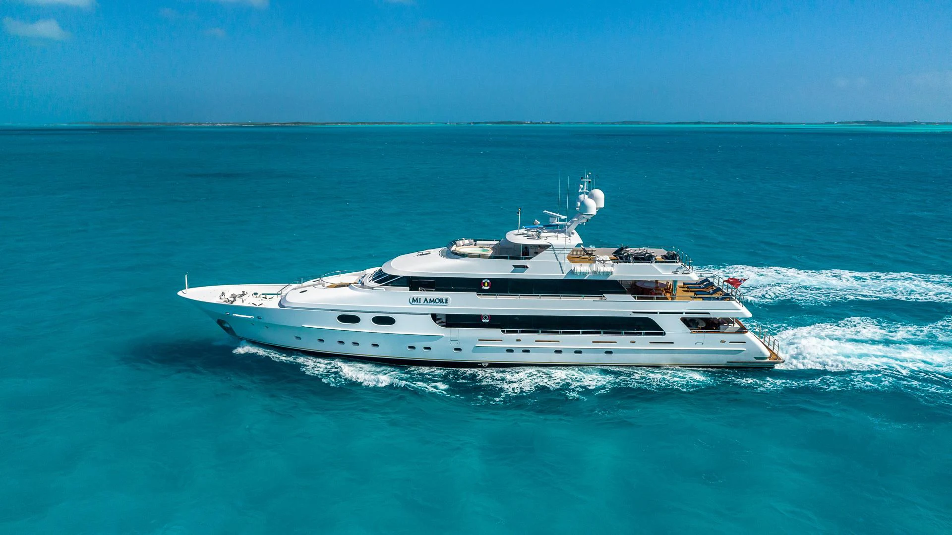 a white yacht in the ocean aboard AMORE Yacht for Charter
