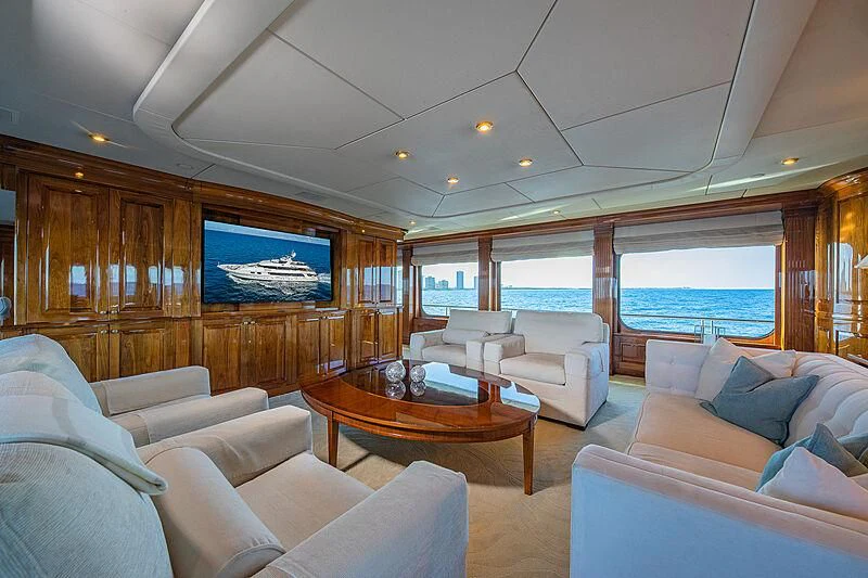 a living room with a large screen aboard AMORE Yacht for Charter