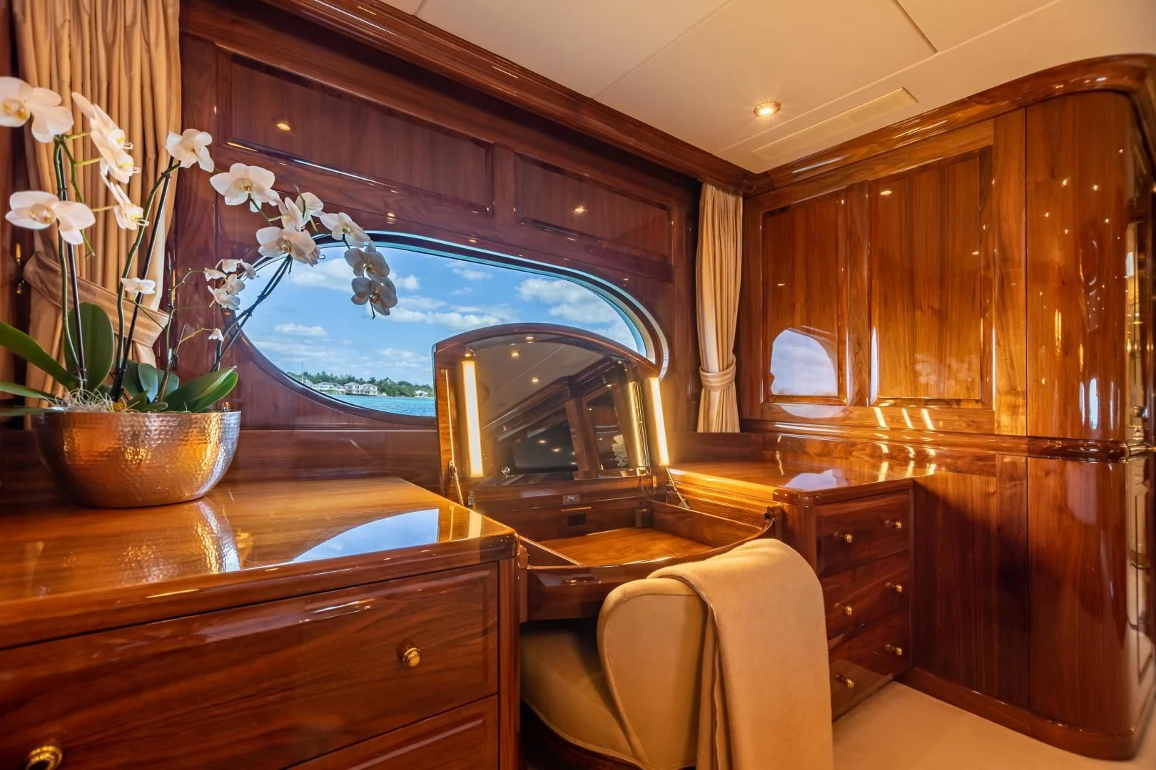 a room with a mirror and furniture aboard AMORE Yacht for Charter