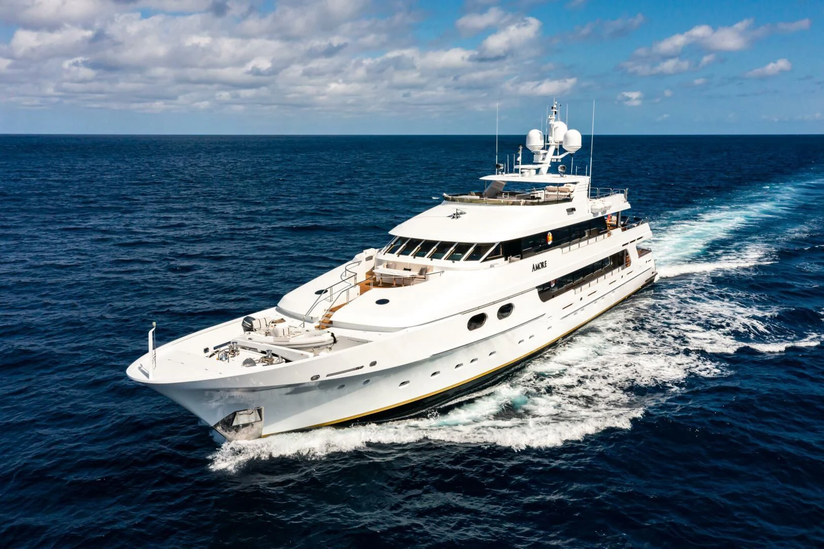 a white boat on the water aboard AMORE Yacht for Charter