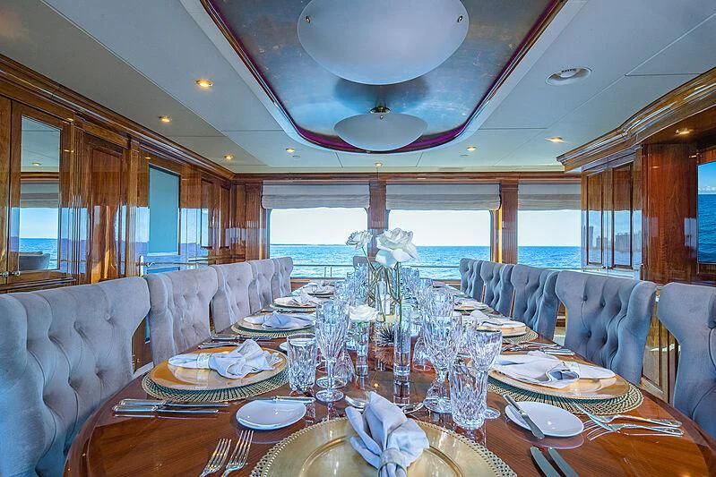 a dining room with a large table aboard AMORE Yacht for Charter
