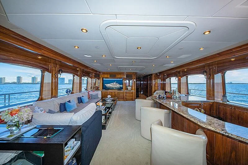 a living room with a large window aboard AMORE Yacht for Charter