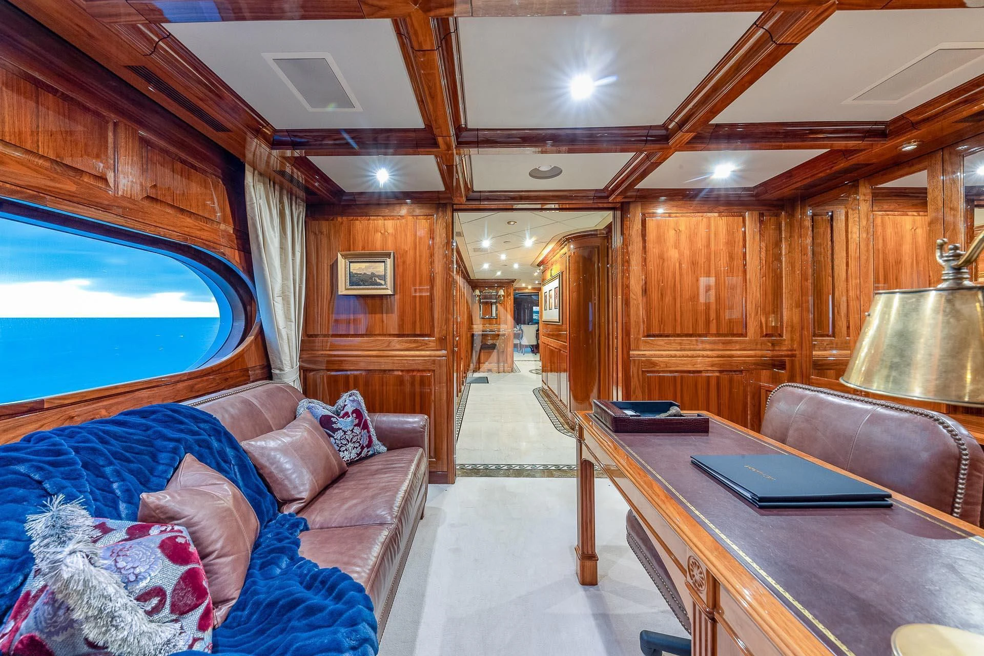 a living room with a couch and a table aboard AMORE Yacht for Charter