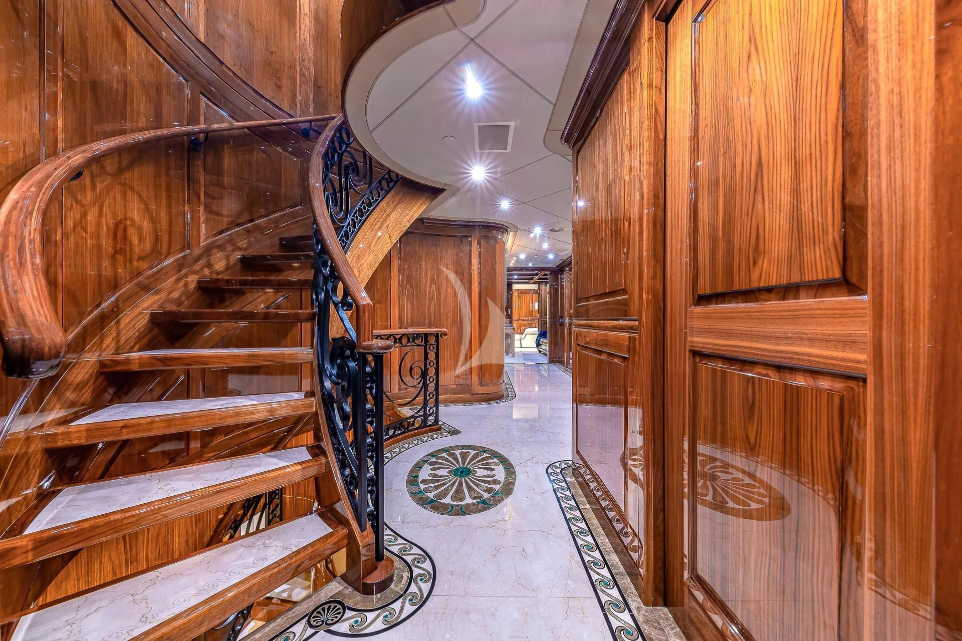 a staircase in a building aboard AMORE Yacht for Charter
