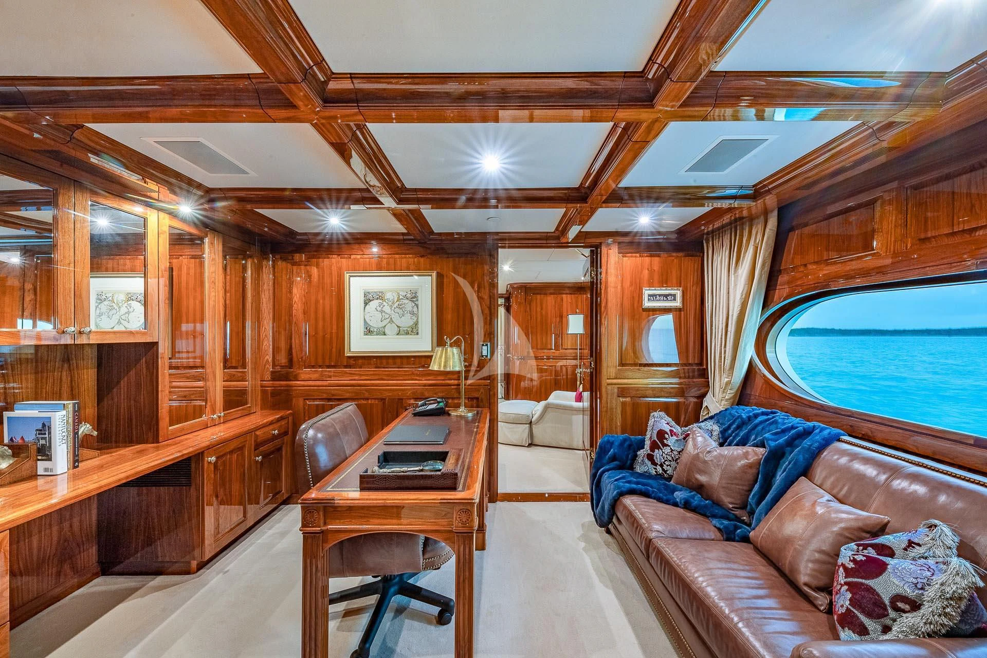 a cabin with a couch and a table aboard AMORE Yacht for Charter