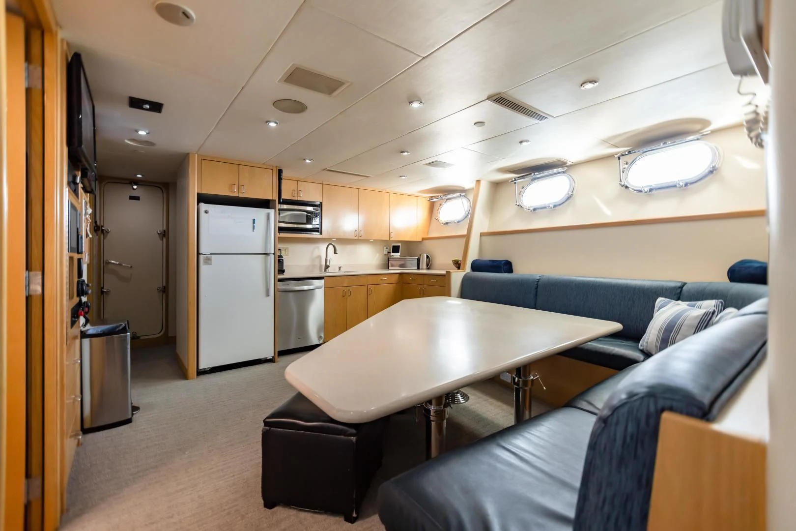 a room with a couch and a table aboard AMORE Yacht for Charter