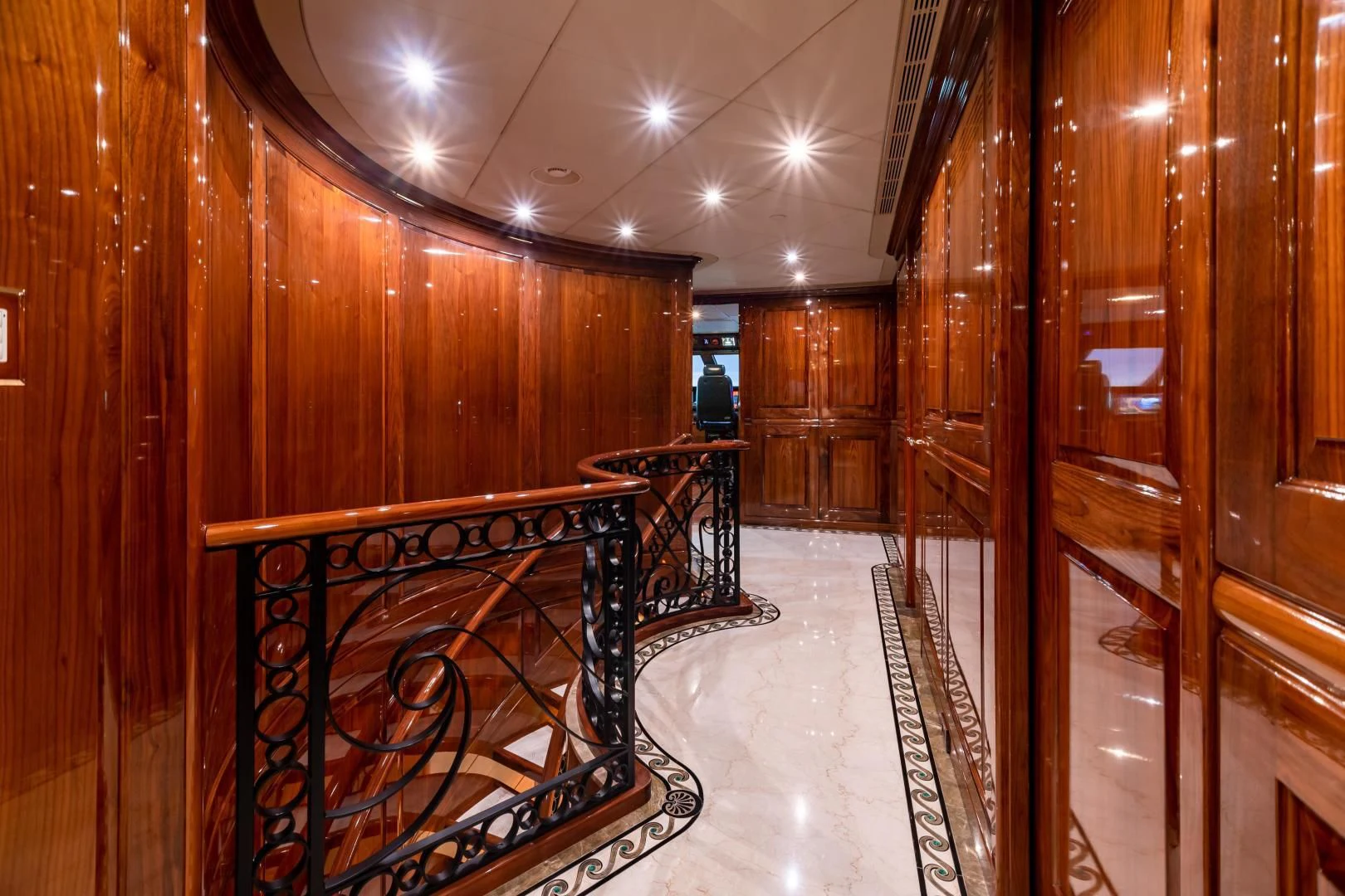 a room with wooden walls and a staircase aboard AMORE Yacht for Charter