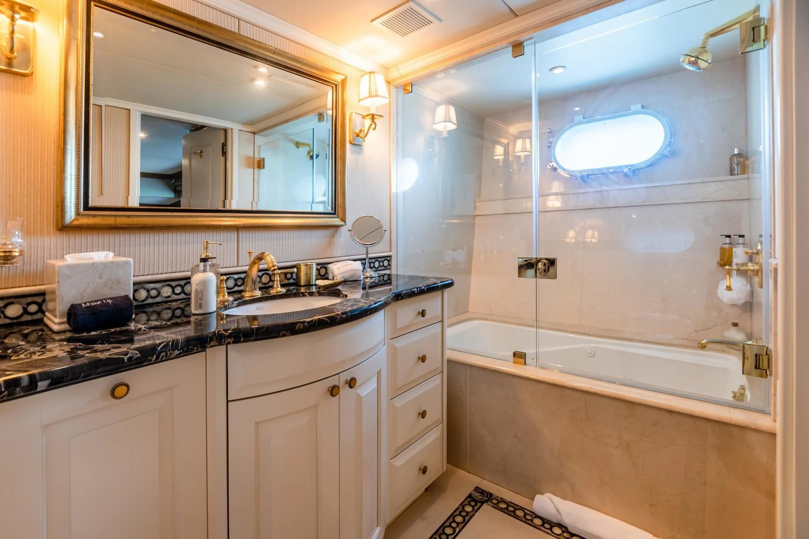 a bathroom with a large mirror aboard AMORE Yacht for Charter