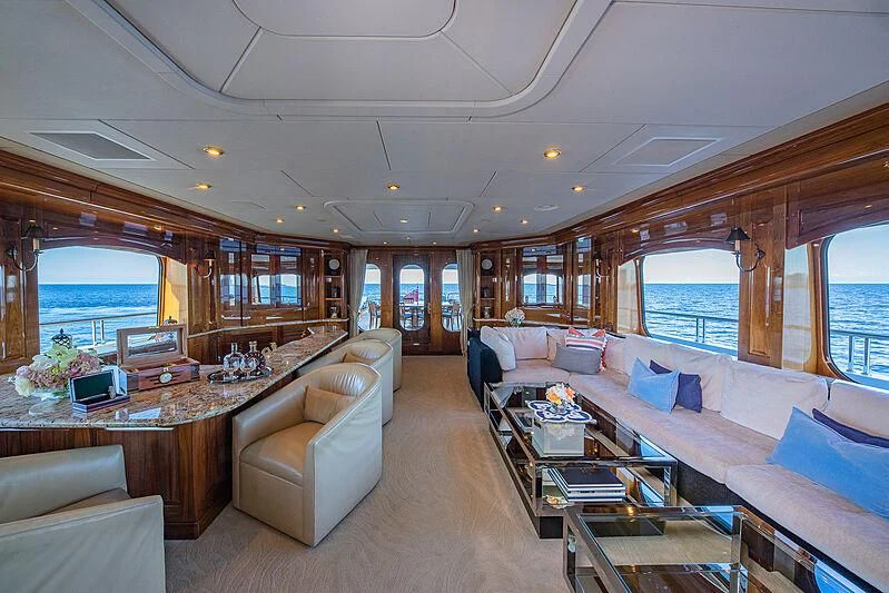 a living room with a large open window aboard AMORE Yacht for Charter