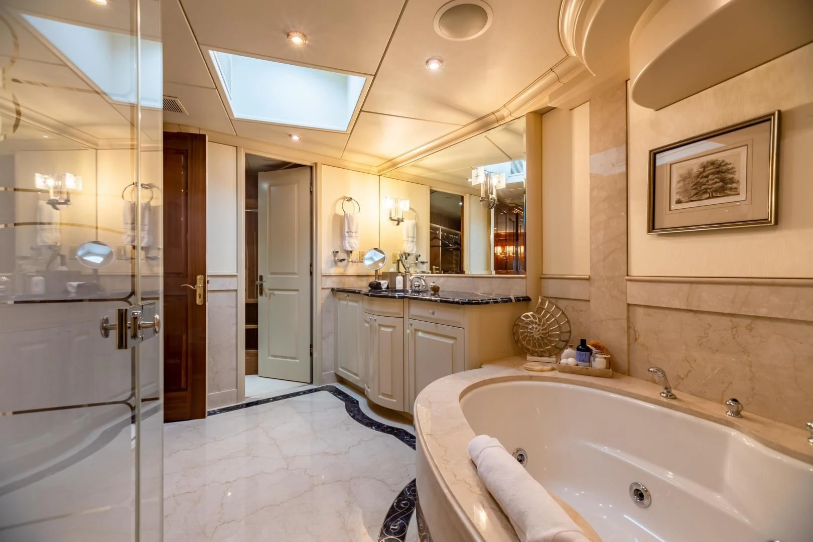 a bathroom with a bathtub and shower aboard AMORE Yacht for Charter