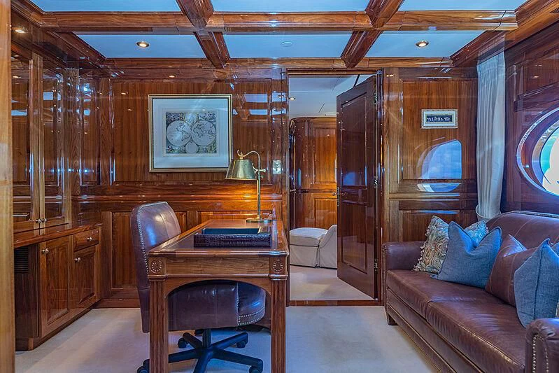 a living room with a couch and a table aboard AMORE Yacht for Charter