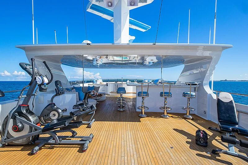 a deck with a large ship in the water aboard AMORE Yacht for Charter