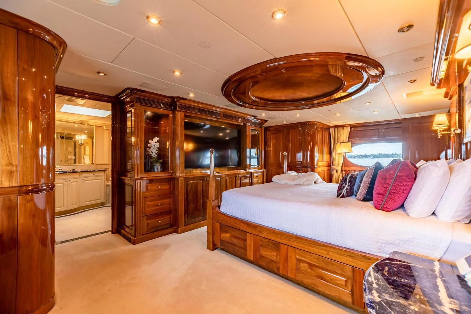 a large bedroom with a large bed aboard AMORE Yacht for Charter
