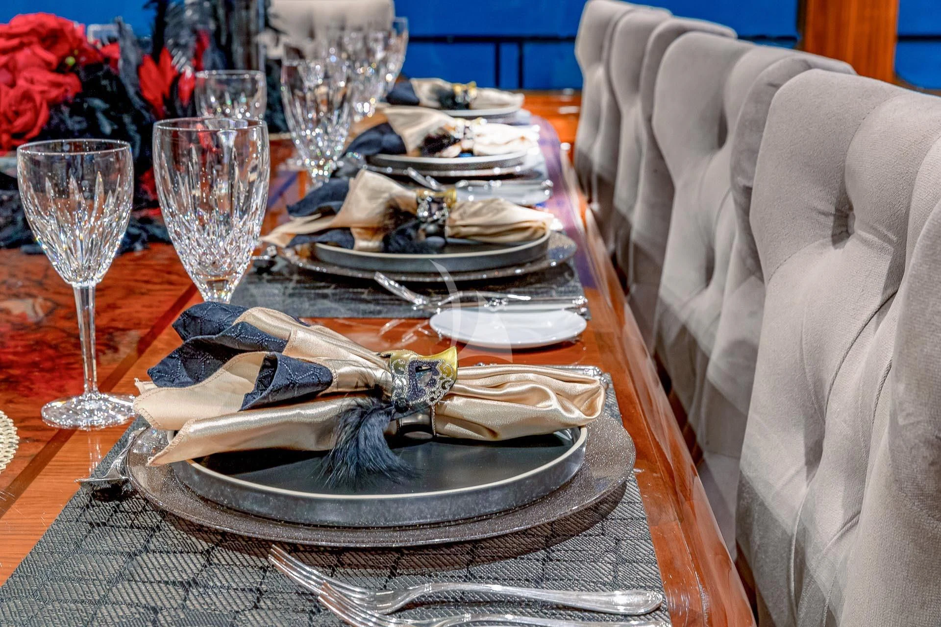 a table with food and glasses aboard AMORE Yacht for Charter
