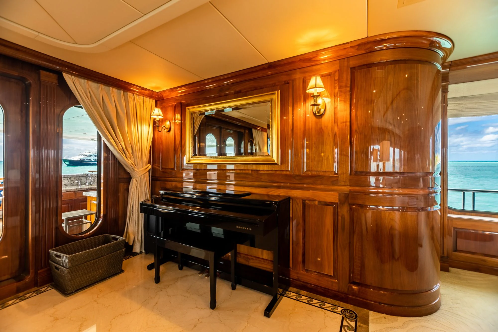 a piano in a room aboard AMORE Yacht for Charter