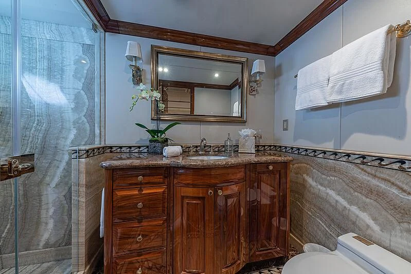 a bathroom with a sink and a mirror aboard AMORE Yacht for Charter