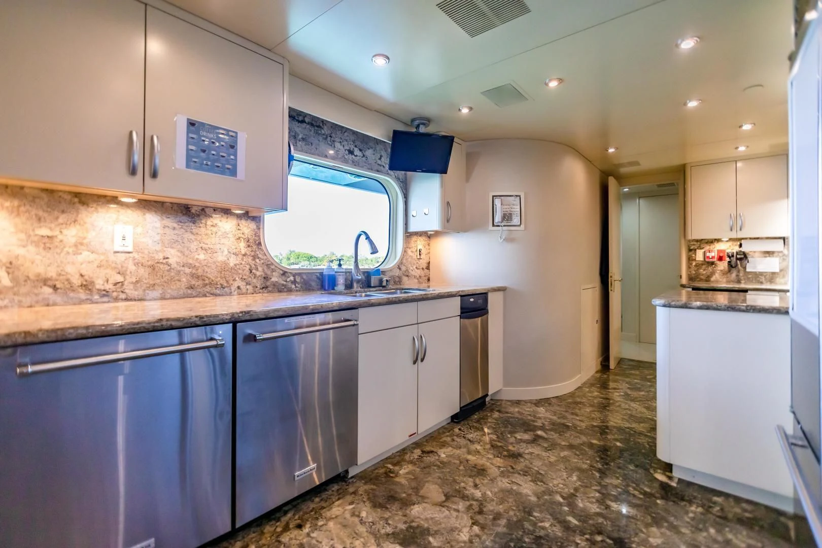 a kitchen with a marble counter top aboard AMORE Yacht for Charter