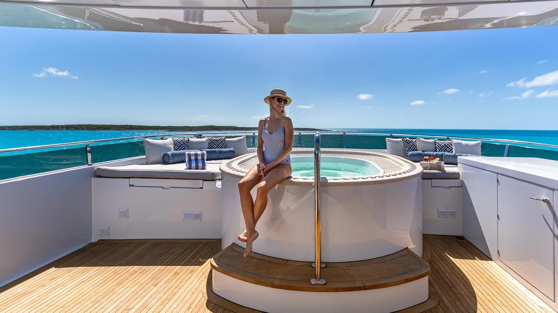 a person sitting on a bathtub aboard AMORE Yacht for Charter