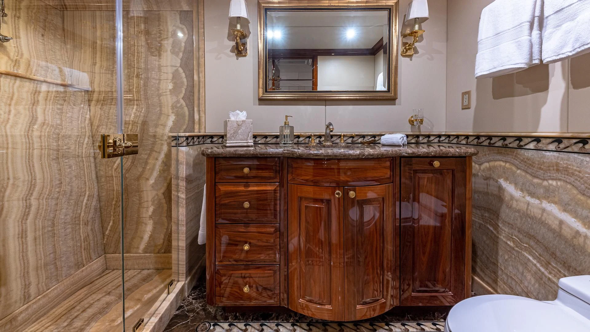 a bathroom with a sink and a mirror aboard AMORE Yacht for Charter