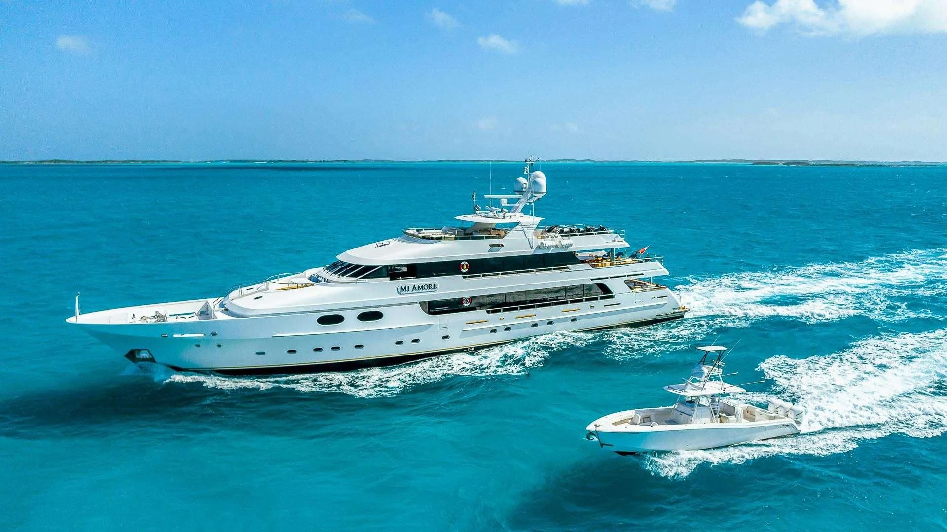a yacht and a boat in the water aboard AMORE Yacht for Charter