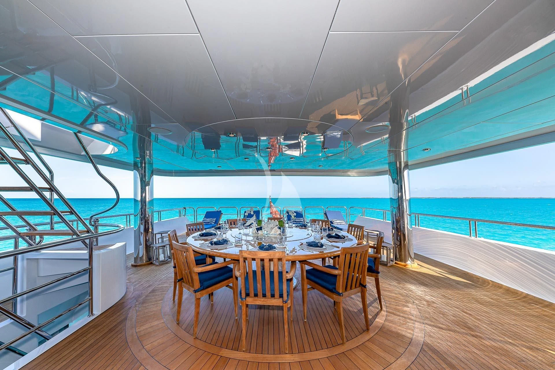 a room with a table and chairs aboard AMORE Yacht for Charter
