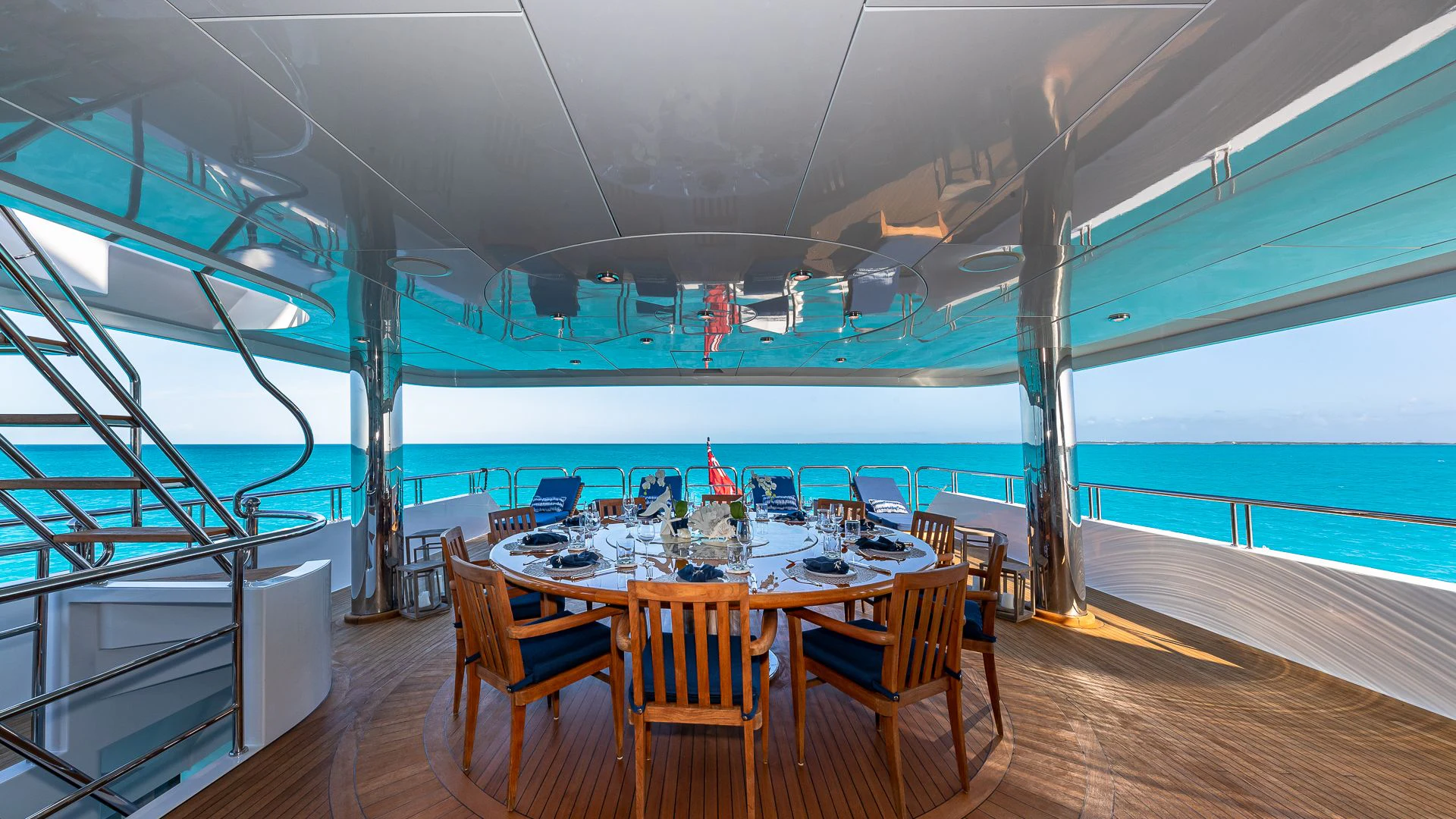 a room with a table and chairs aboard AMORE Yacht for Charter