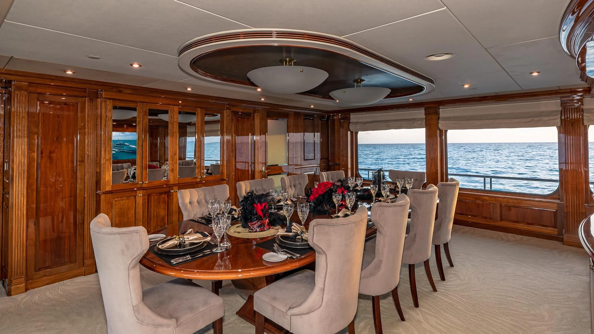 a dining room with a large window aboard AMORE Yacht for Charter