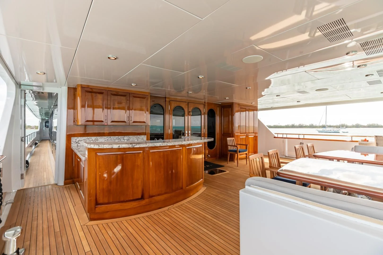 a large kitchen with wooden cabinets aboard AMORE Yacht for Charter