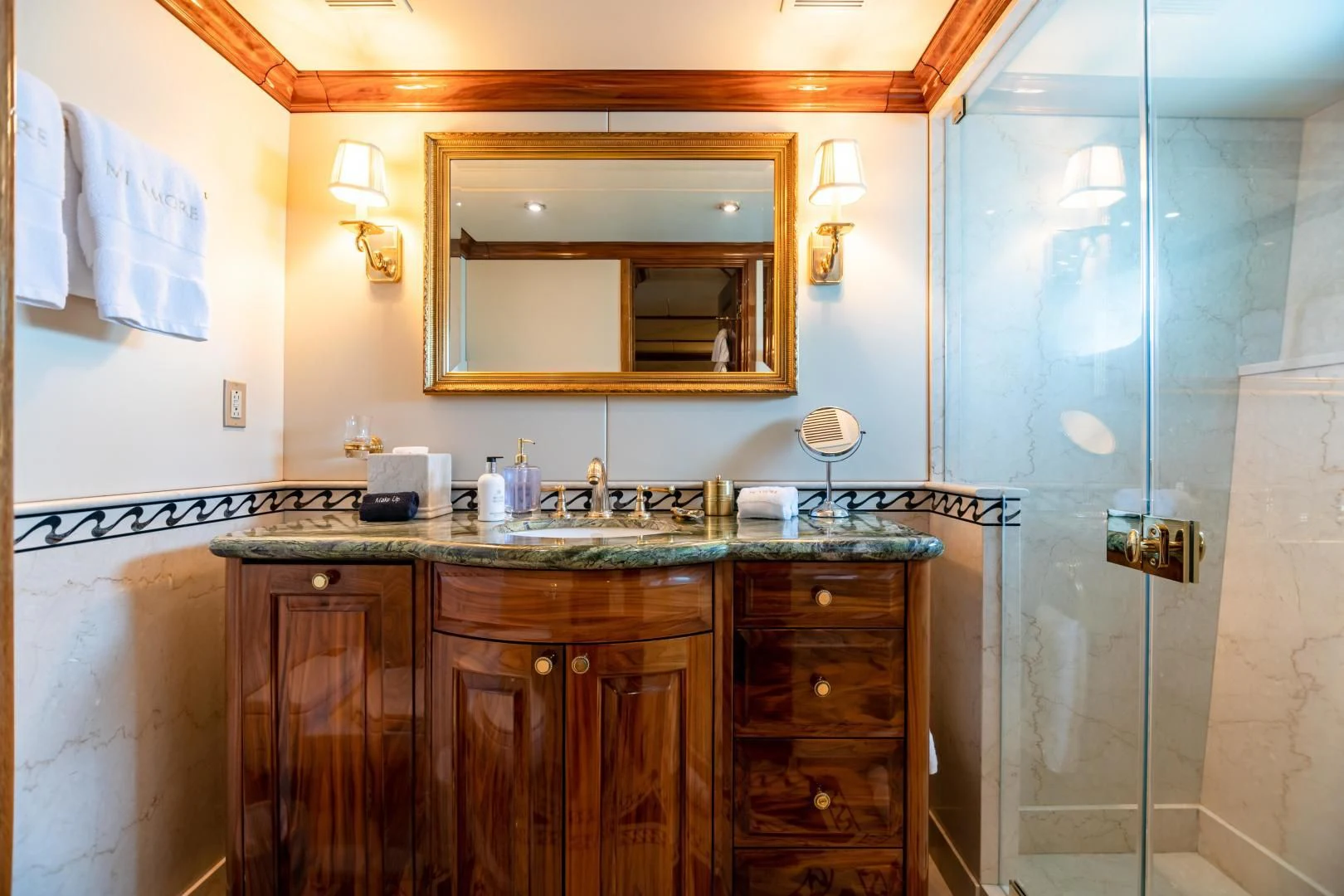a bathroom with a glass shower aboard AMORE Yacht for Charter