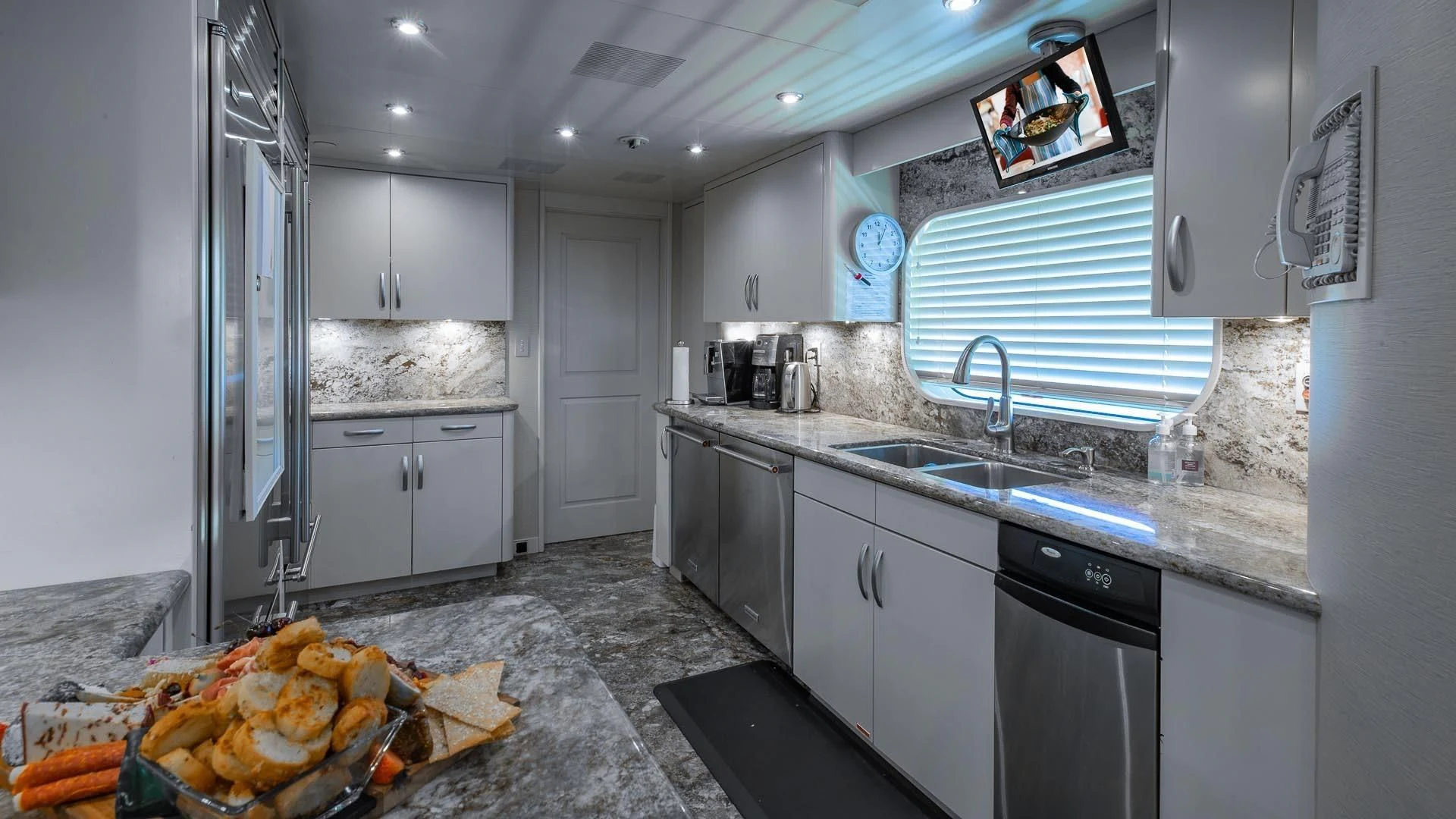 a kitchen with a large island aboard AMORE Yacht for Charter