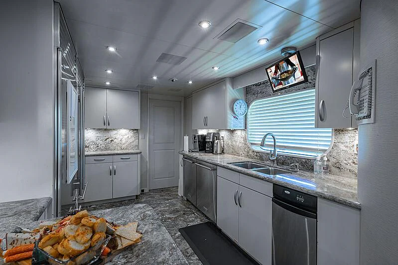 a kitchen with a large island aboard AMORE Yacht for Charter