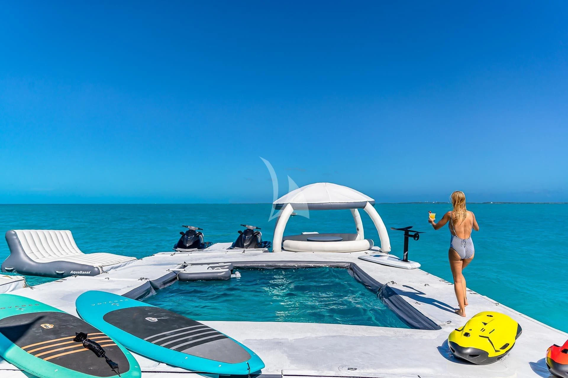a person standing on a boat aboard AMORE Yacht for Charter