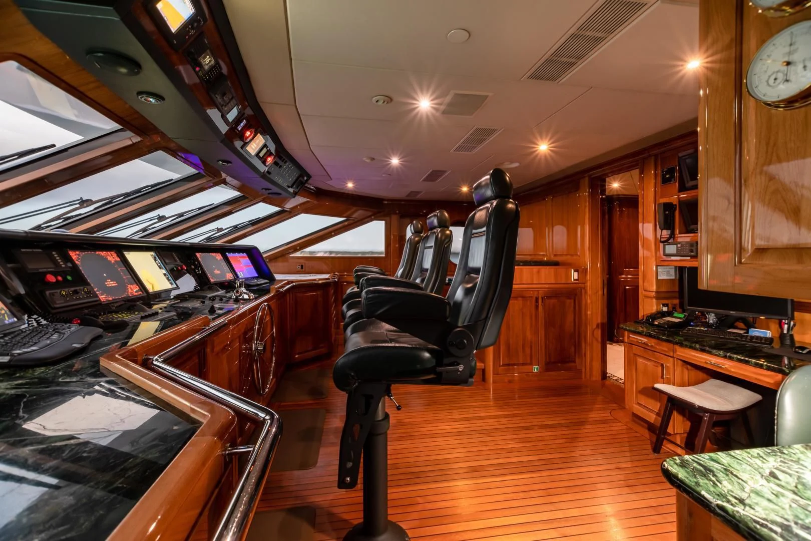 a room with a piano and a piano aboard AMORE Yacht for Charter