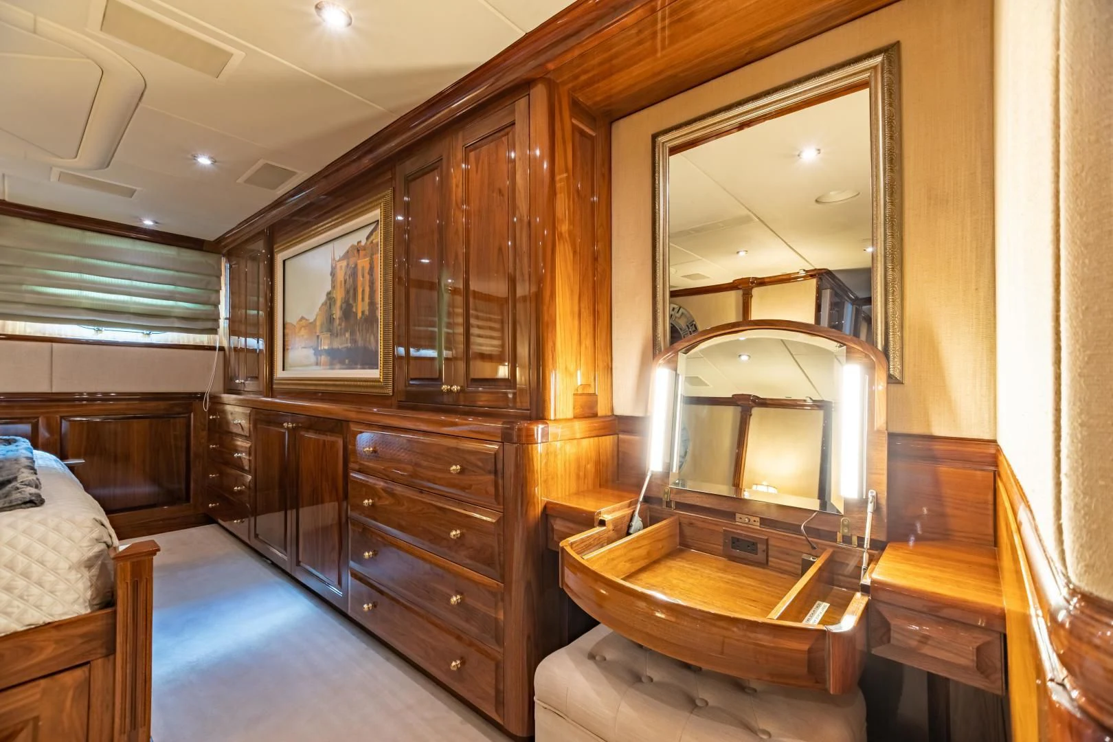 a room with a mirror and a dresser aboard AMORE Yacht for Charter