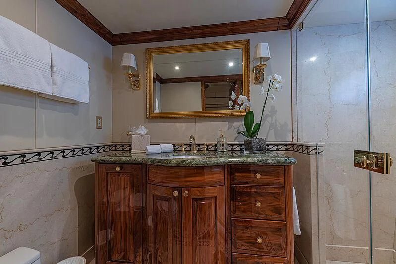 a bathroom with a sink and a mirror aboard AMORE Yacht for Charter