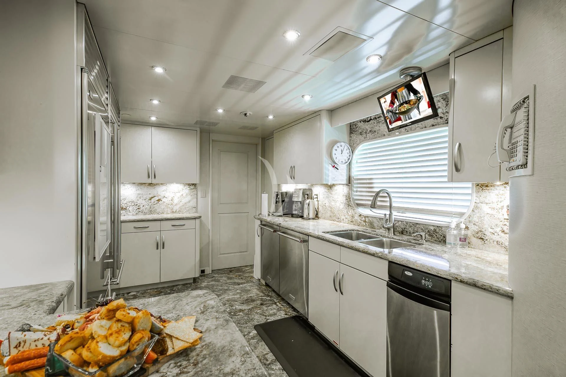a kitchen with a large countertop aboard AMORE Yacht for Charter