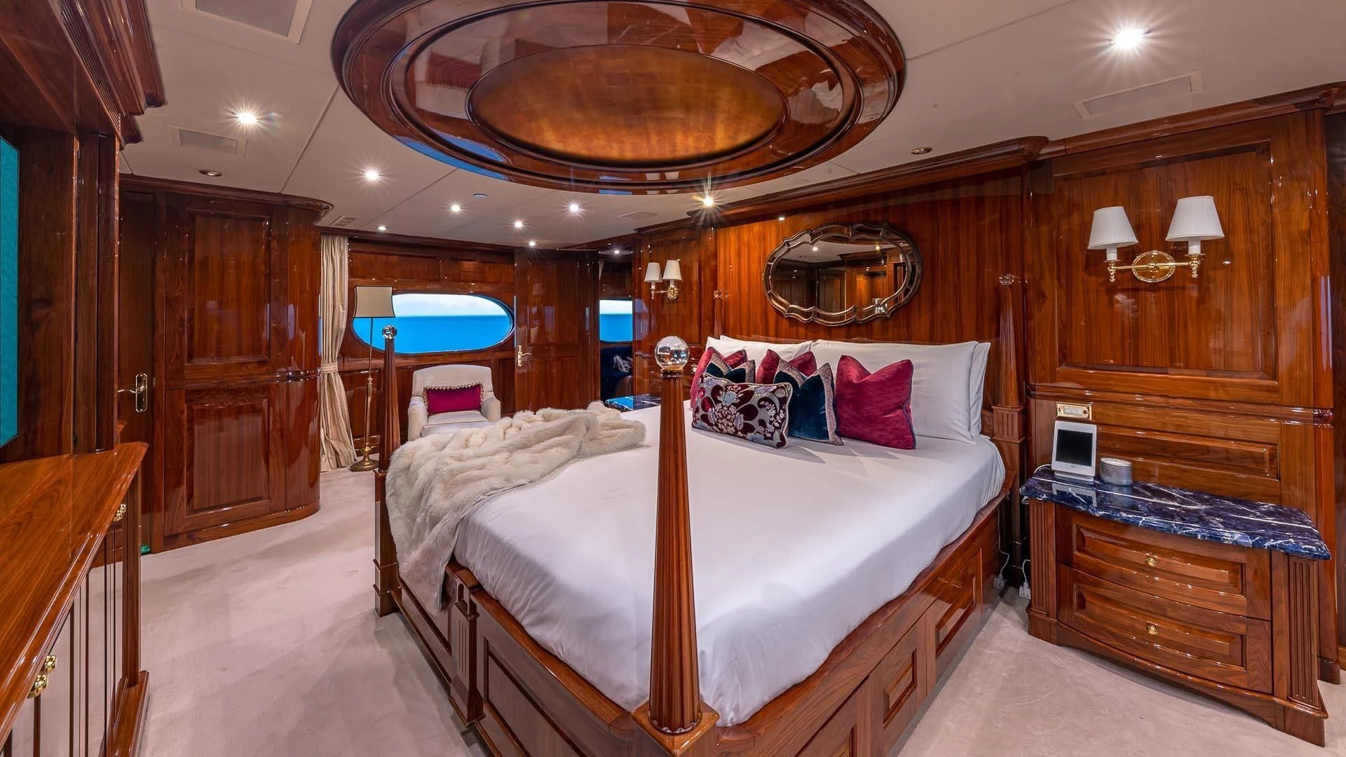 a room with a bed and a table aboard AMORE Yacht for Charter