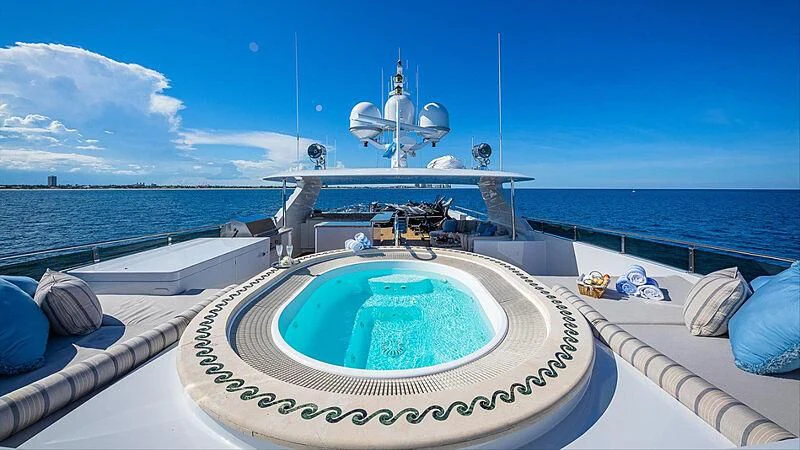 a pool with a large round pool aboard AMORE Yacht for Charter