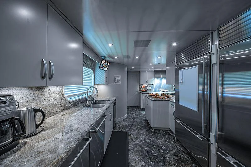 a kitchen with stainless steel appliances aboard AMORE Yacht for Charter