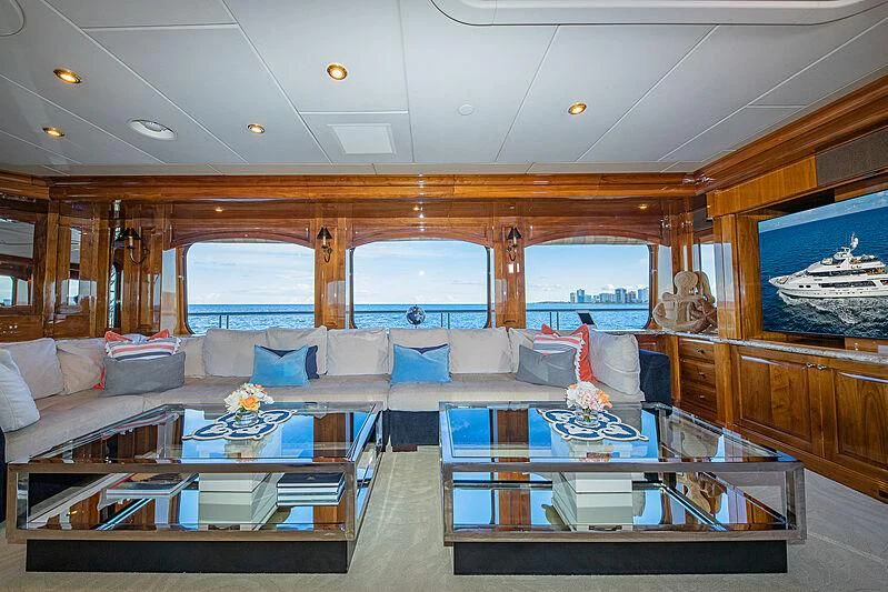 a living room with a large window aboard AMORE Yacht for Charter
