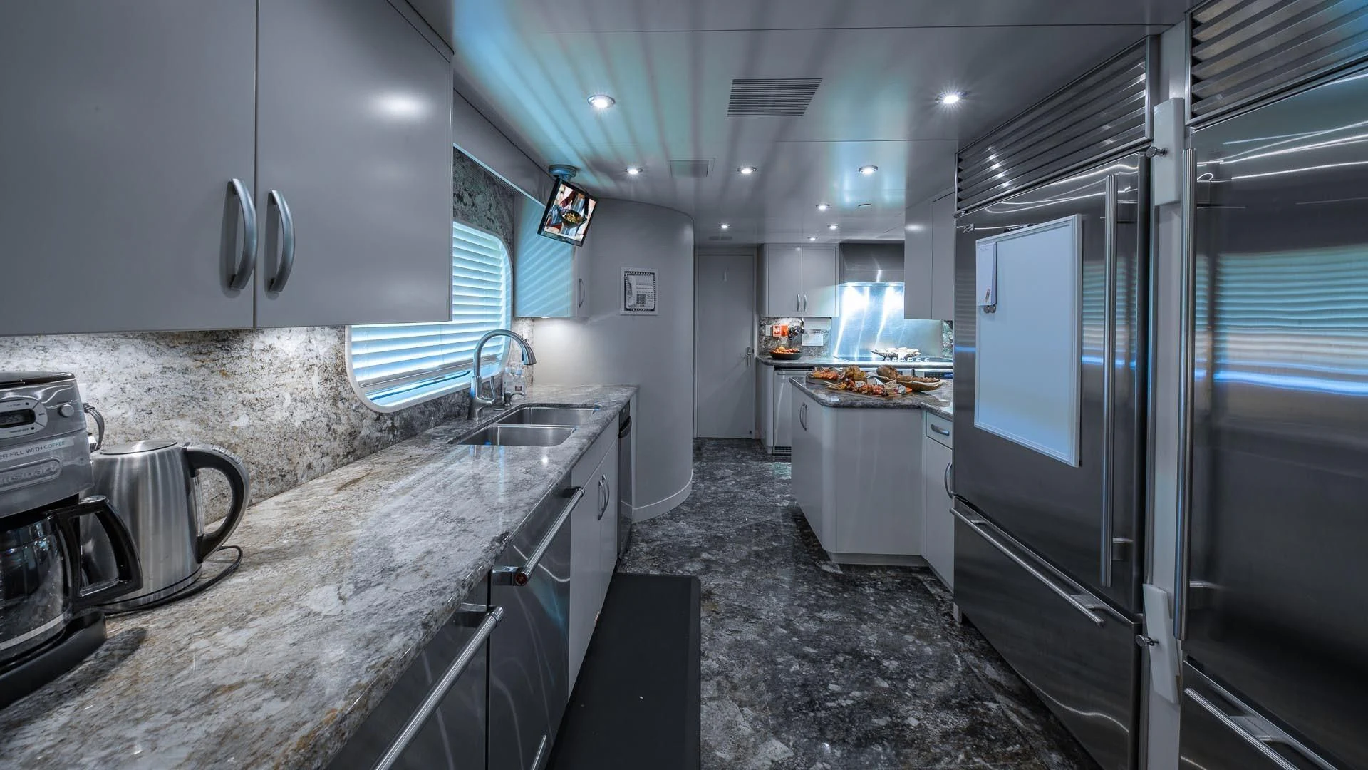a kitchen with stainless steel appliances aboard AMORE Yacht for Charter
