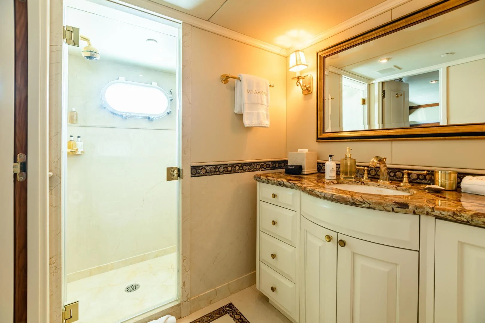 a bathroom with a sink and a mirror aboard AMORE Yacht for Charter
