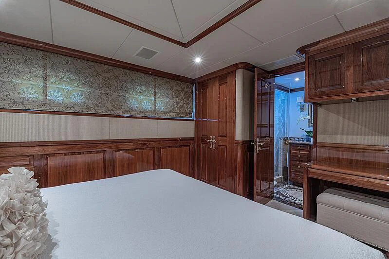 a large room with wooden cabinets aboard AMORE Yacht for Charter