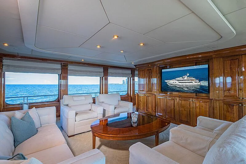 a living room with a large television aboard AMORE Yacht for Charter