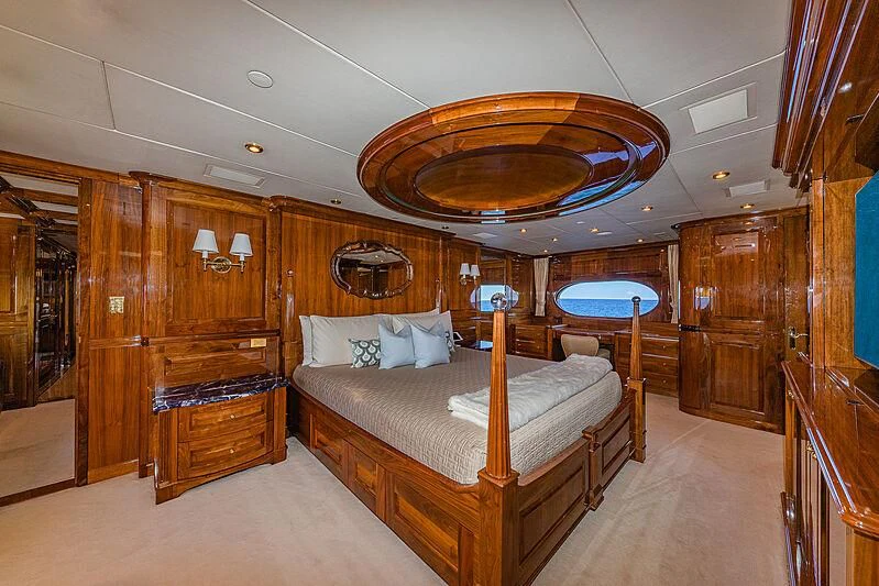a large bedroom with a large bed aboard AMORE Yacht for Charter