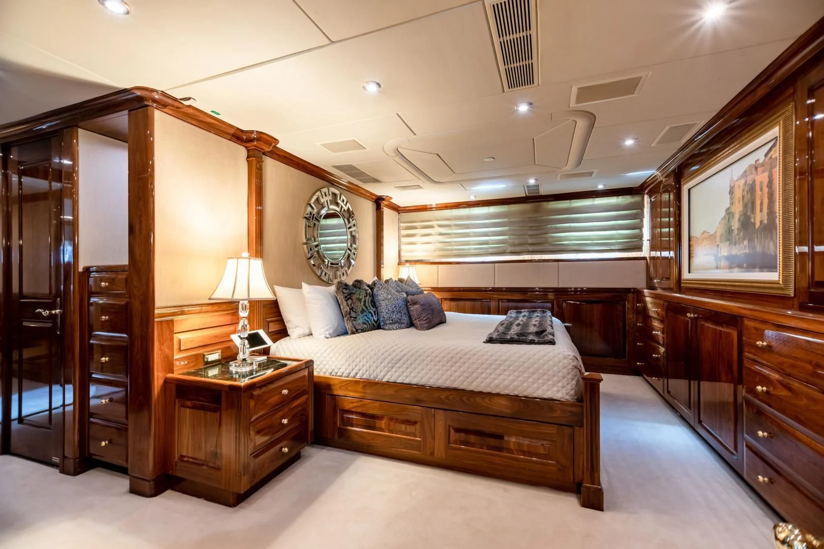 a bedroom with a large mirror aboard AMORE Yacht for Charter