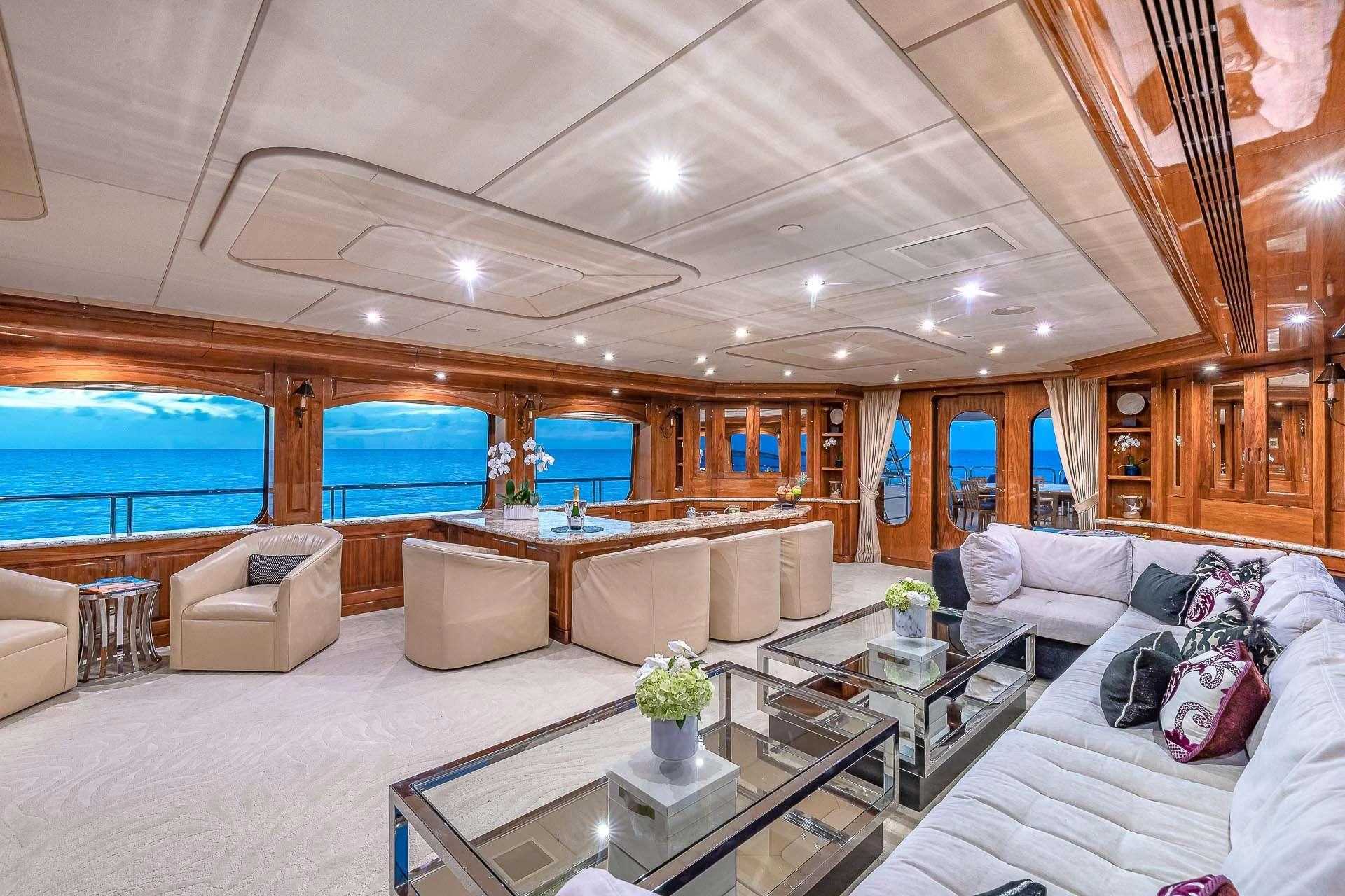 a living room with a large window aboard AMORE Yacht for Charter
